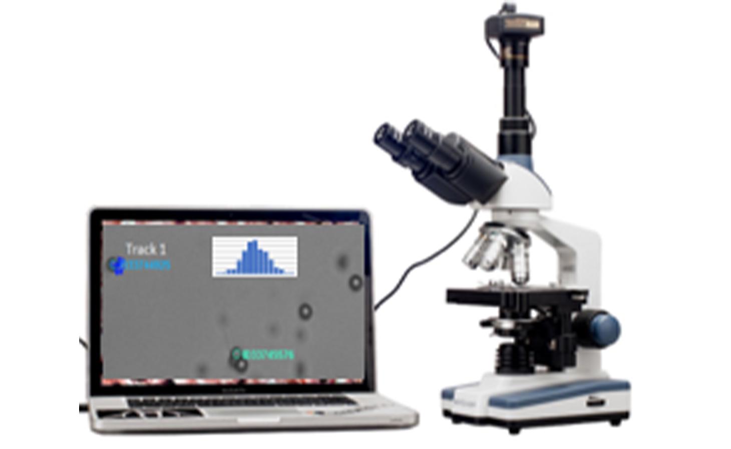 A stock image of a microscope hooked up to a laptop measuring data.
