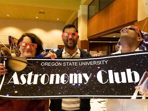 Astronomy Club members with banner