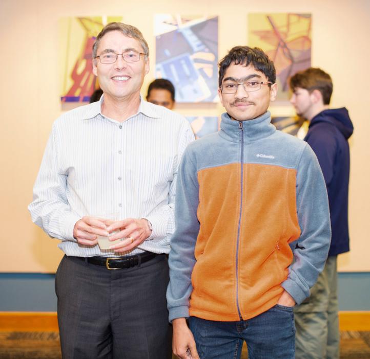 Carl Wieman with student in lobby
