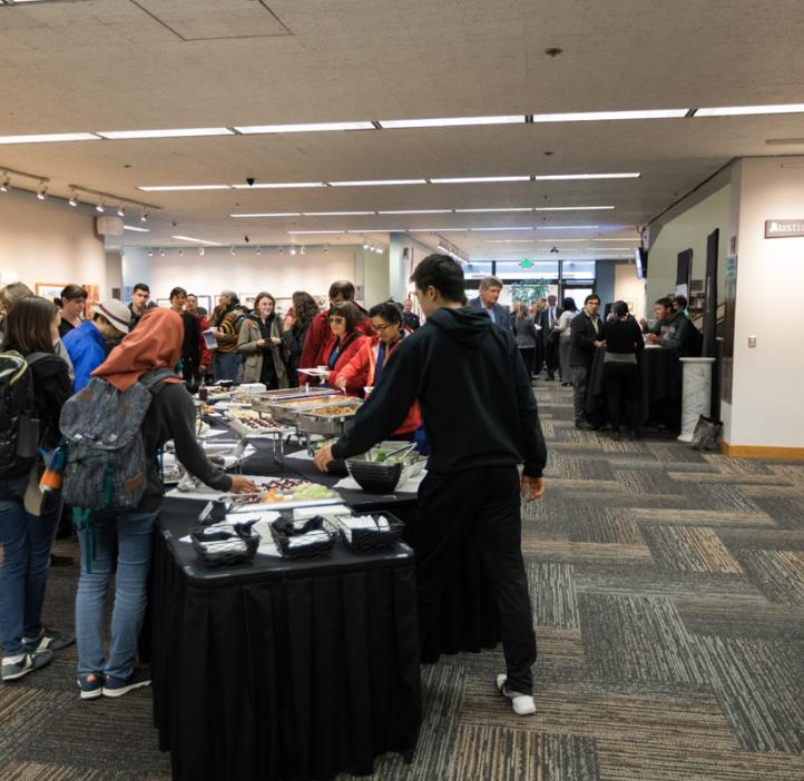 students and event attendees grabbing food